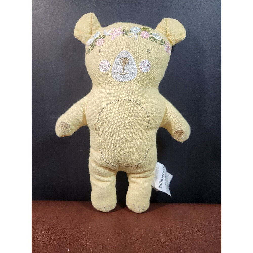 Pillowfort bear embroidered floral plush pillow, a yellow stuffed teddy toy.